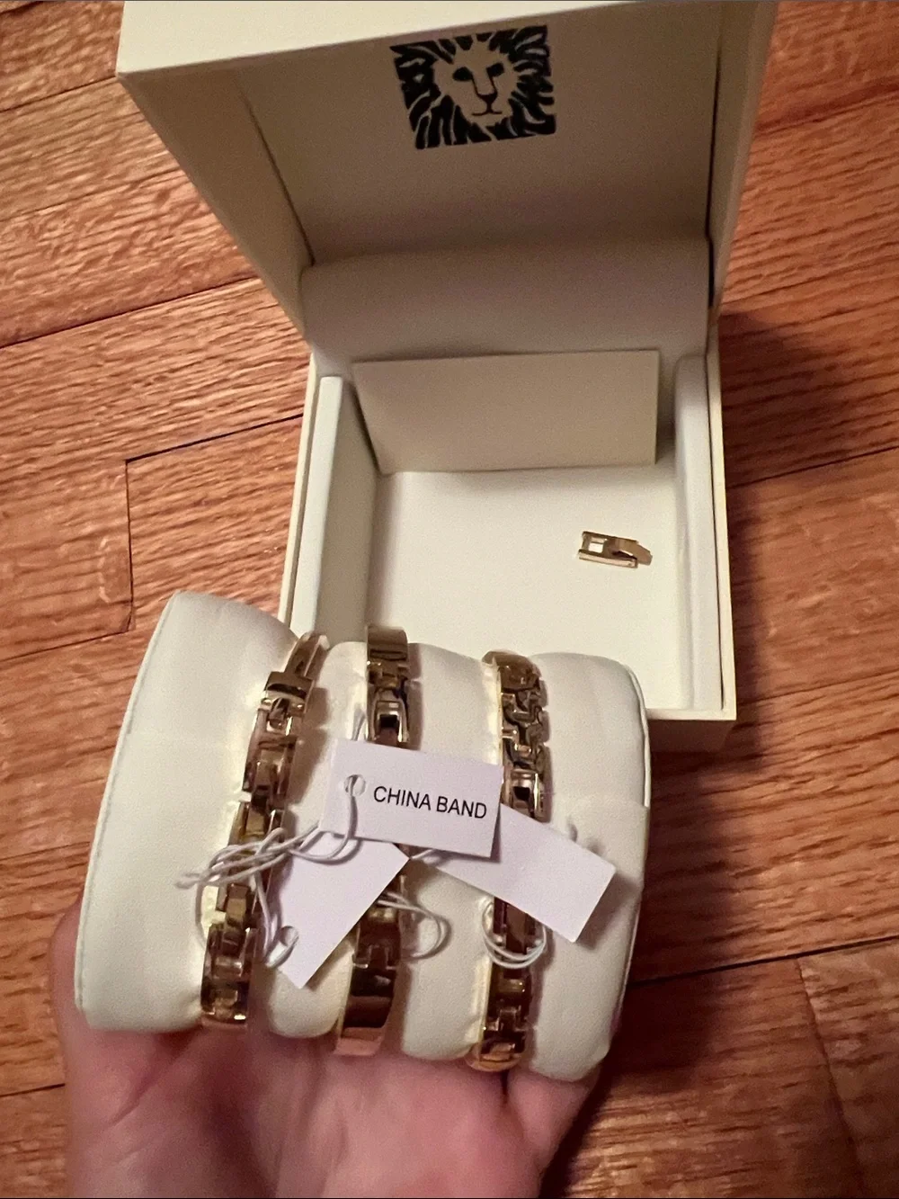 Anne Klein Gold and Black Watch with Two Coordinating Bangles